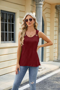 Women’s sleeveless V-neck tank top with button design in solid color, perfect for casual or dressy summer looks.








