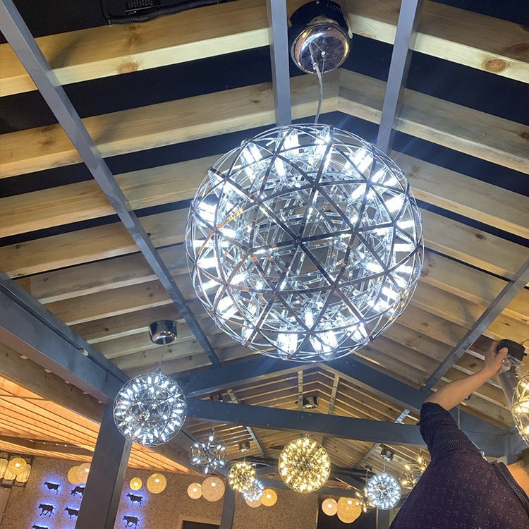 Elegant spherical ball chandelier in a modern commercial lobby

