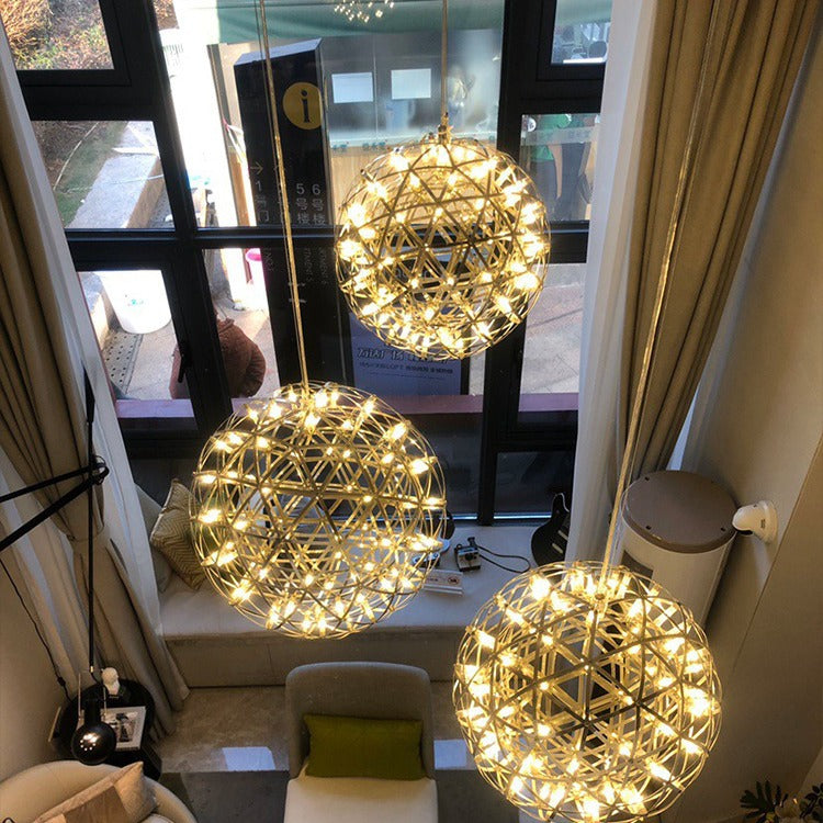Elegant spherical ball chandelier in a modern commercial lobby


