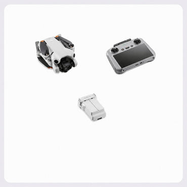 A white and gray drone with its remote controller and a matching battery pack, arranged on a clean white background with a subtle gray border.
