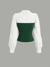 White pinstripe blouse with a green bodice on a gray background