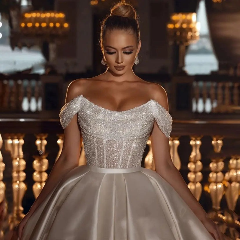 “Falling For You A Line Off Shoulder Wedding Dress – romantic off-shoulder bridal gown with a flattering A-line silhouette – Hot Deal Warehouse bridal”


