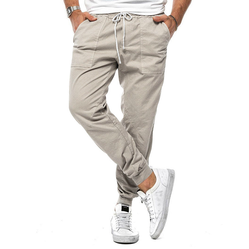 Loose tapered fit casual pants for men, perfect for spring and autumn, with multiple pockets and a stylish, comfortable design for outdoor or leisure wear.