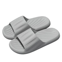 Unisex striped home slippers with thick soles and non-slip bottoms in solid colors.

