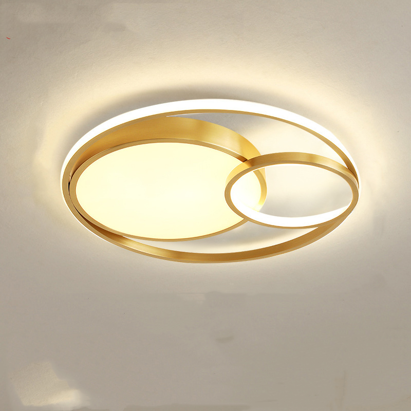 Modern Nordic-style nested round chandelier hanging in a minimalist living room

