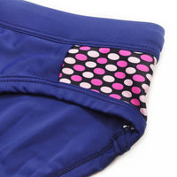 Men’s close-fitting swim briefs with polka dot stitching, designed for beach and sports activities.

