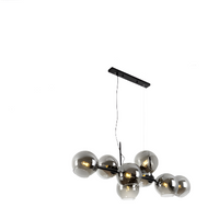 Modern Nordic minimalist glass chandelier lighting in living room setting

