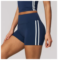 Navy blue athletic shorts with white stripes on a neutral background