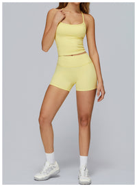 Person wearing a yellow athletic outfit on a gray background