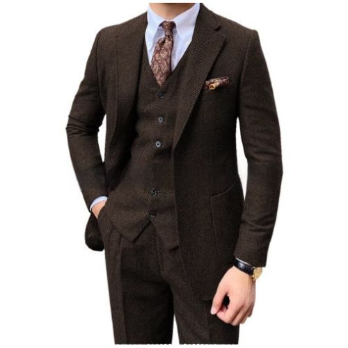 A men's three-piece brown tweed suit including a jacket, vest, and trousers, styled with a white dress shirt, a brown paisley tie, and a matching pocket square on a white background.